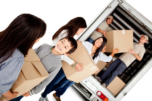 House moving team working in Tottenham Hale with packed boxes and furniture