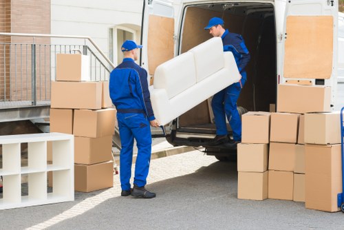 Removal crew loading office furniture near Tottenham Hale business premises